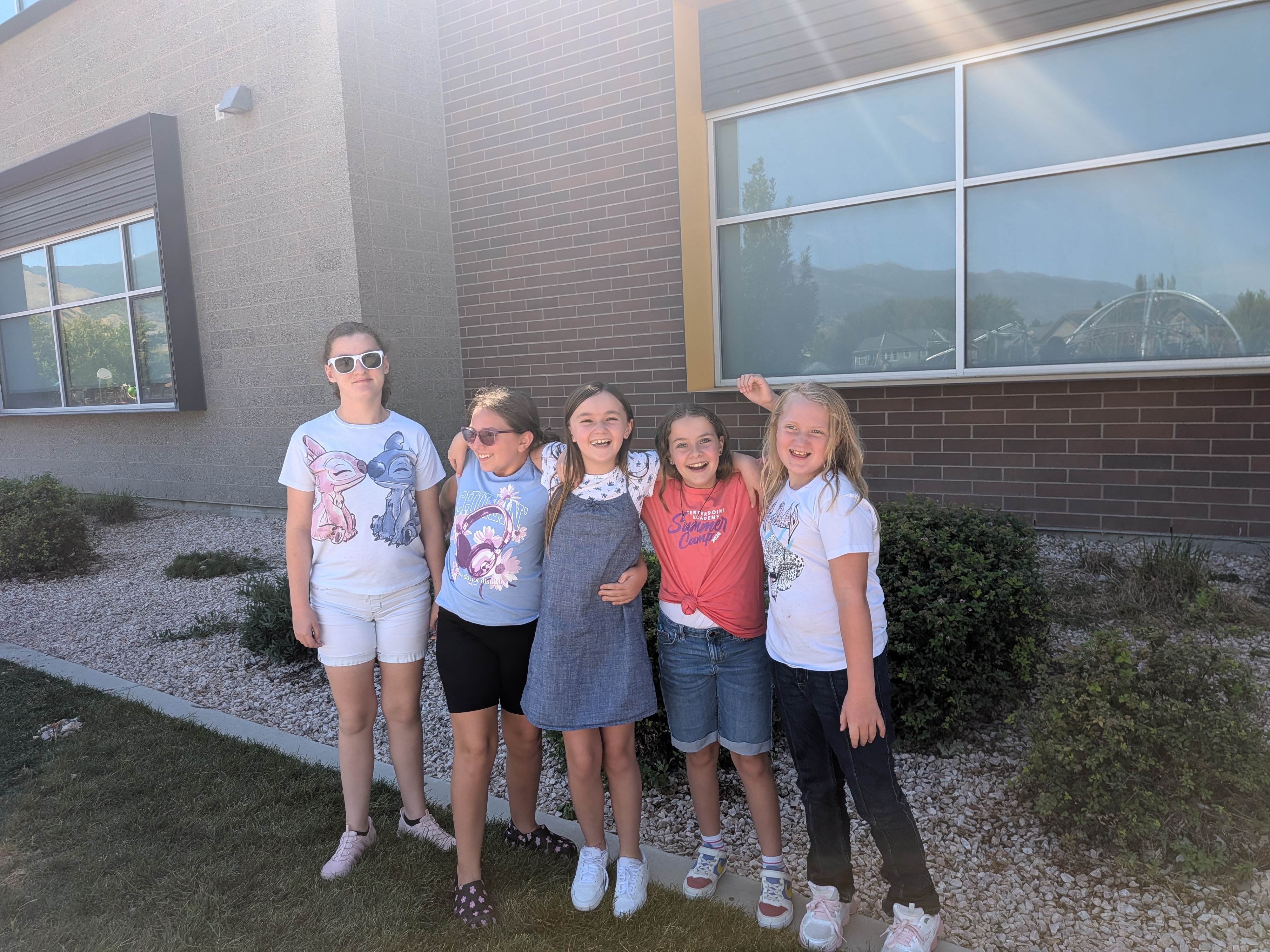 Students posing for a picture out on the playground.