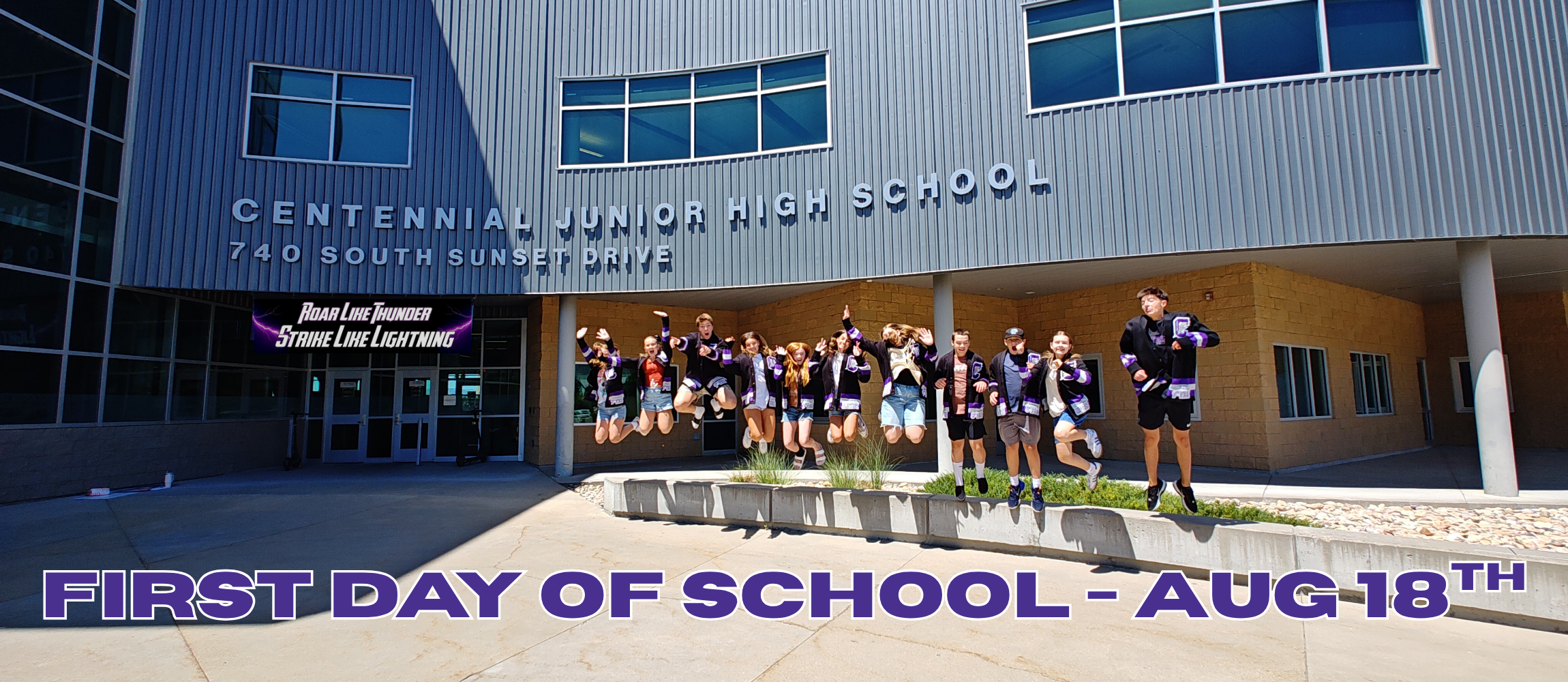 First Day of School - Aug 19th  - Student body officers jumping in front of school