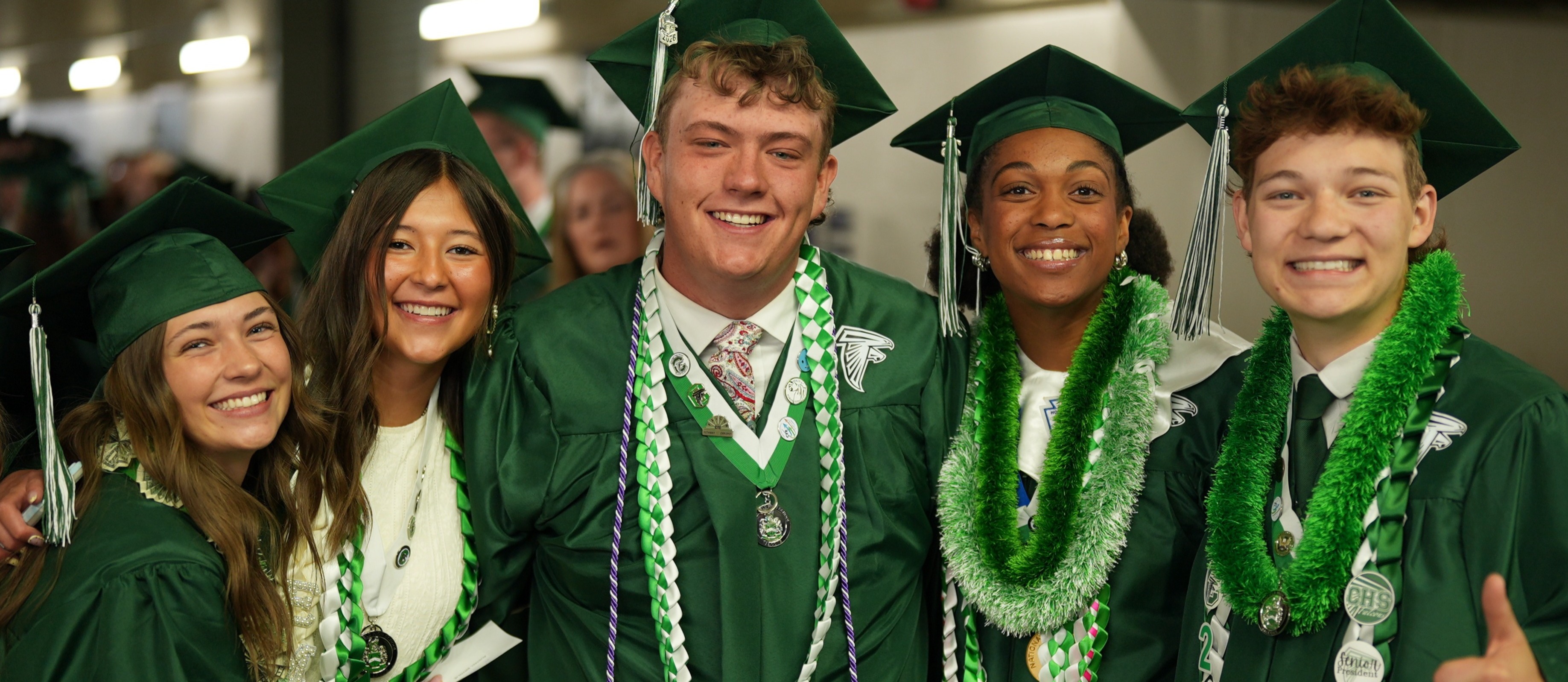 CHS students posing for a picture at graduation ceremony