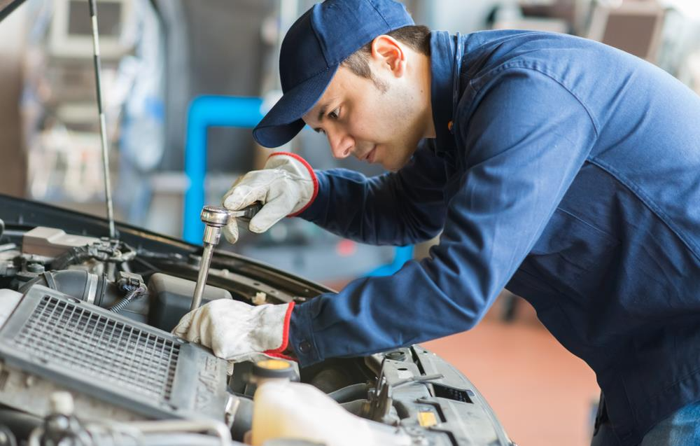 Man fixing an automotive engine