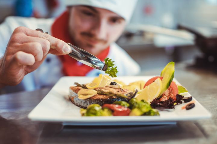 Man plating food in a restaurant