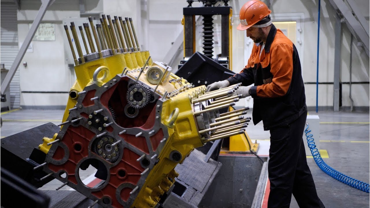 man fixing diesel engine