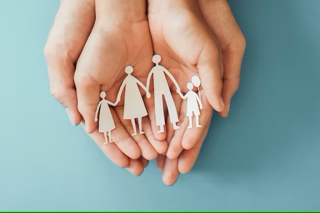 hands holding papercut family