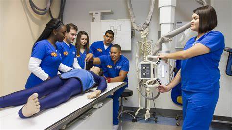 medical students examine a patient