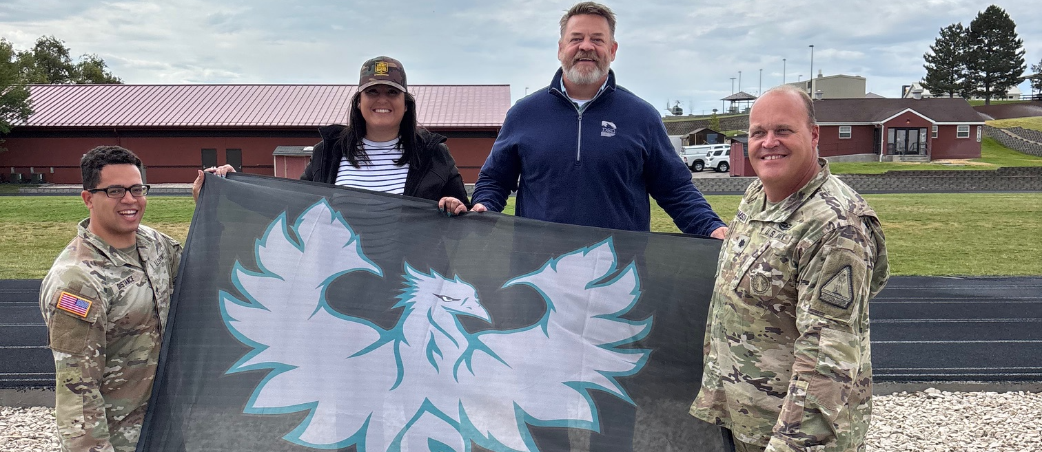 Celia Larson &amp; Mike Bradfield ready to ride in a Blackhawk