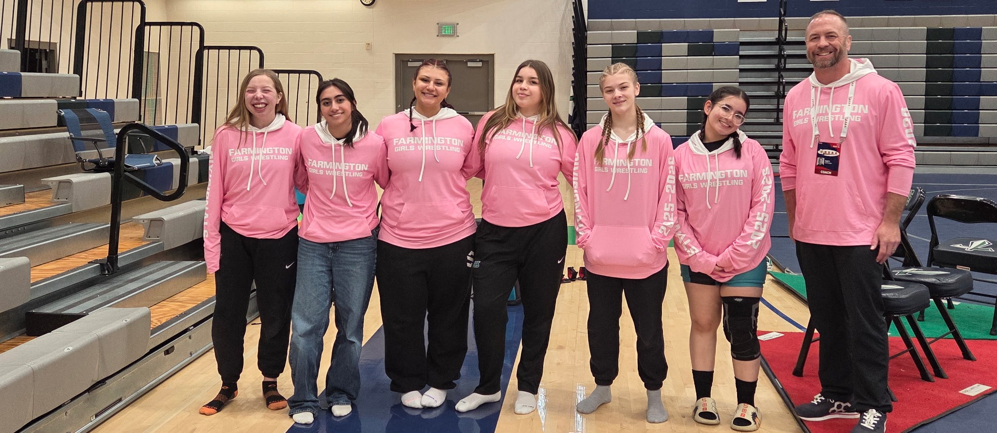 Girls Wrestling team in pink shirts