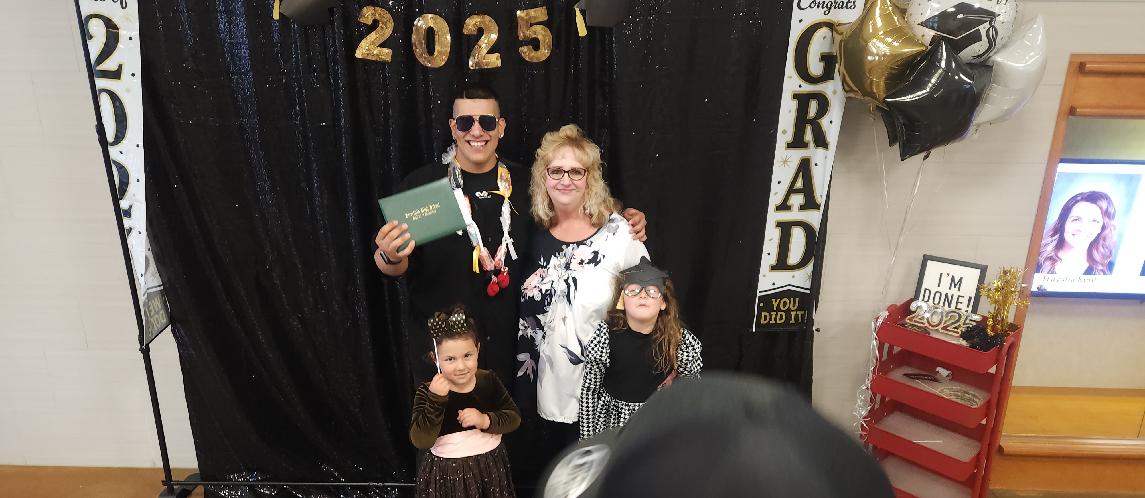 Graduation and one of our Families celebrating and taking their picture together.