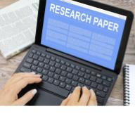 Image of research paper on a laptop