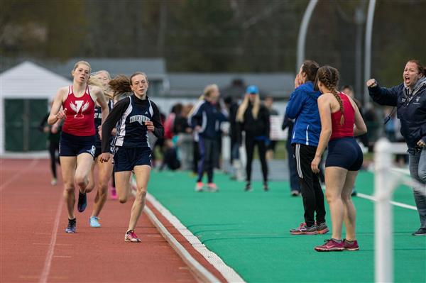 A group of girls running on a track