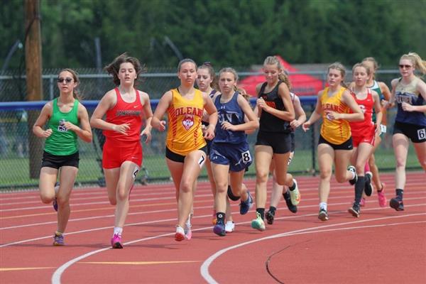 A group of women running on a track
