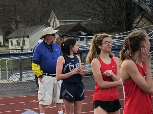 A group of people standing next to each other on a field