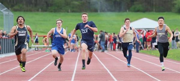 A group of men running on a track