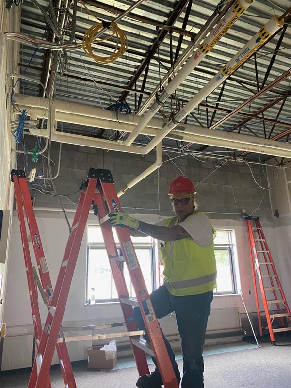 A man climbing on a ladder