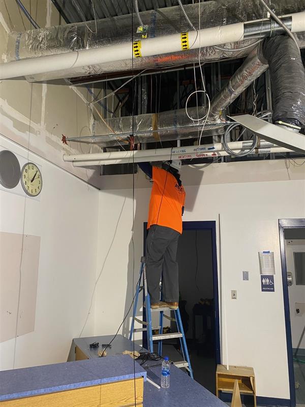 A man climbing on a ladder