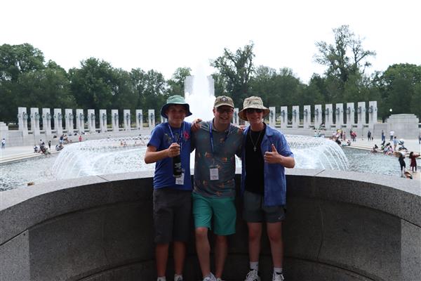 3 boys taking photo
