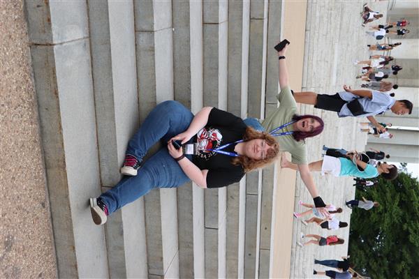A picutre of a girl sitting on the stair