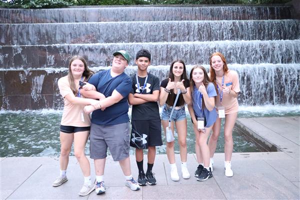 Group of boys and girla taking group picture