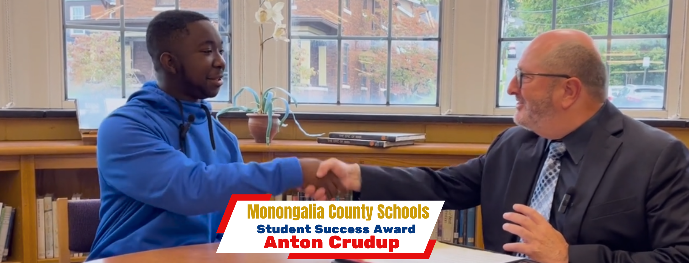 Student Success Award - Anton Crudup and Dr. Eddie Campbell during an interview in the library at Morgantown High School 