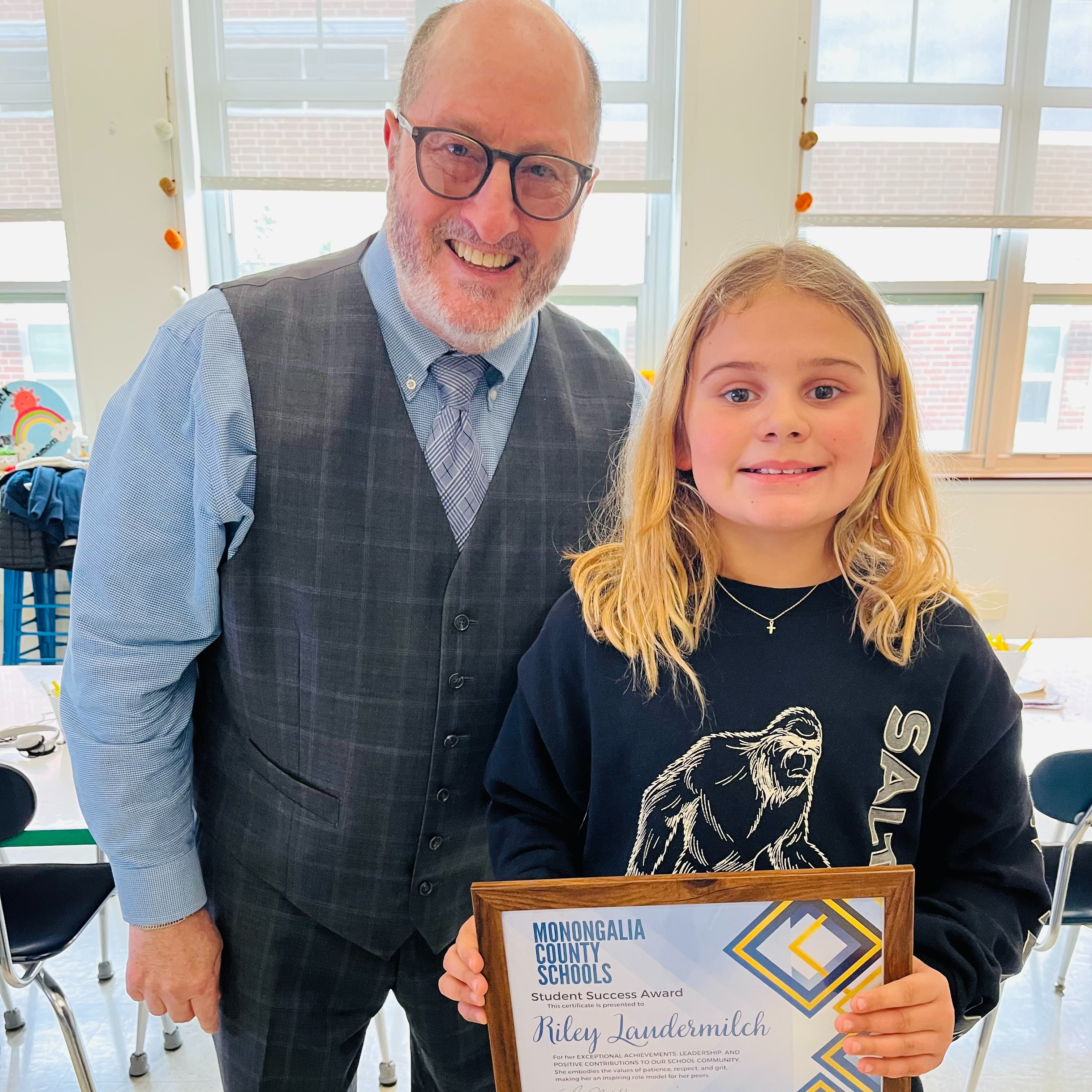 Dr. Campbell and our Student of the Month Riley Laudermilch from Eastwood Elemenary School