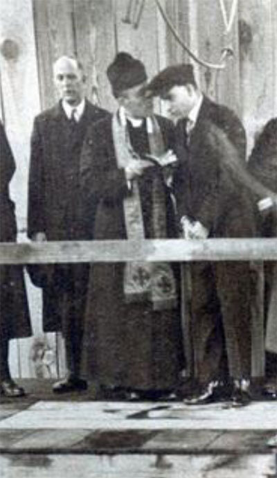 Father Seneese, a Catholic Priest from Herrin, gives Santis comfort before he was hanged.
