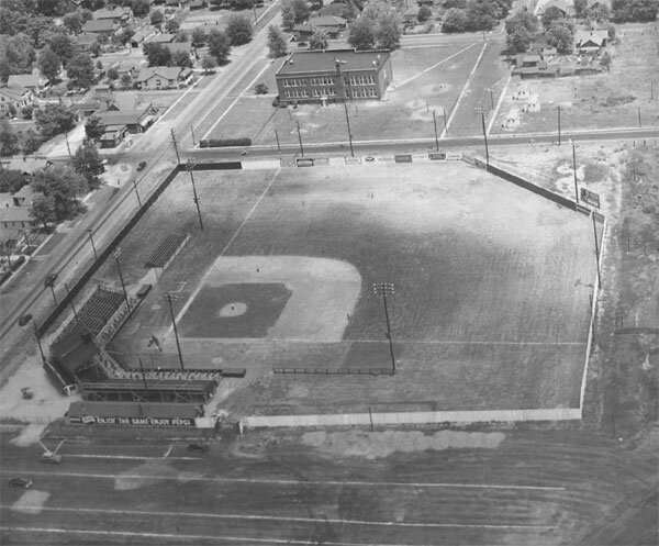 A historic baseball field viewed from above, showcasing the layout and grandstands.