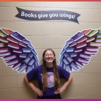 student with wings display