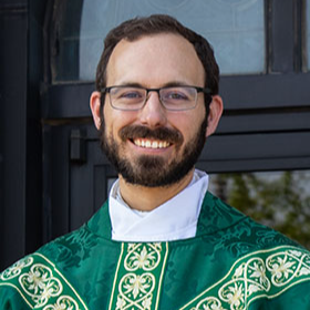 priest in green