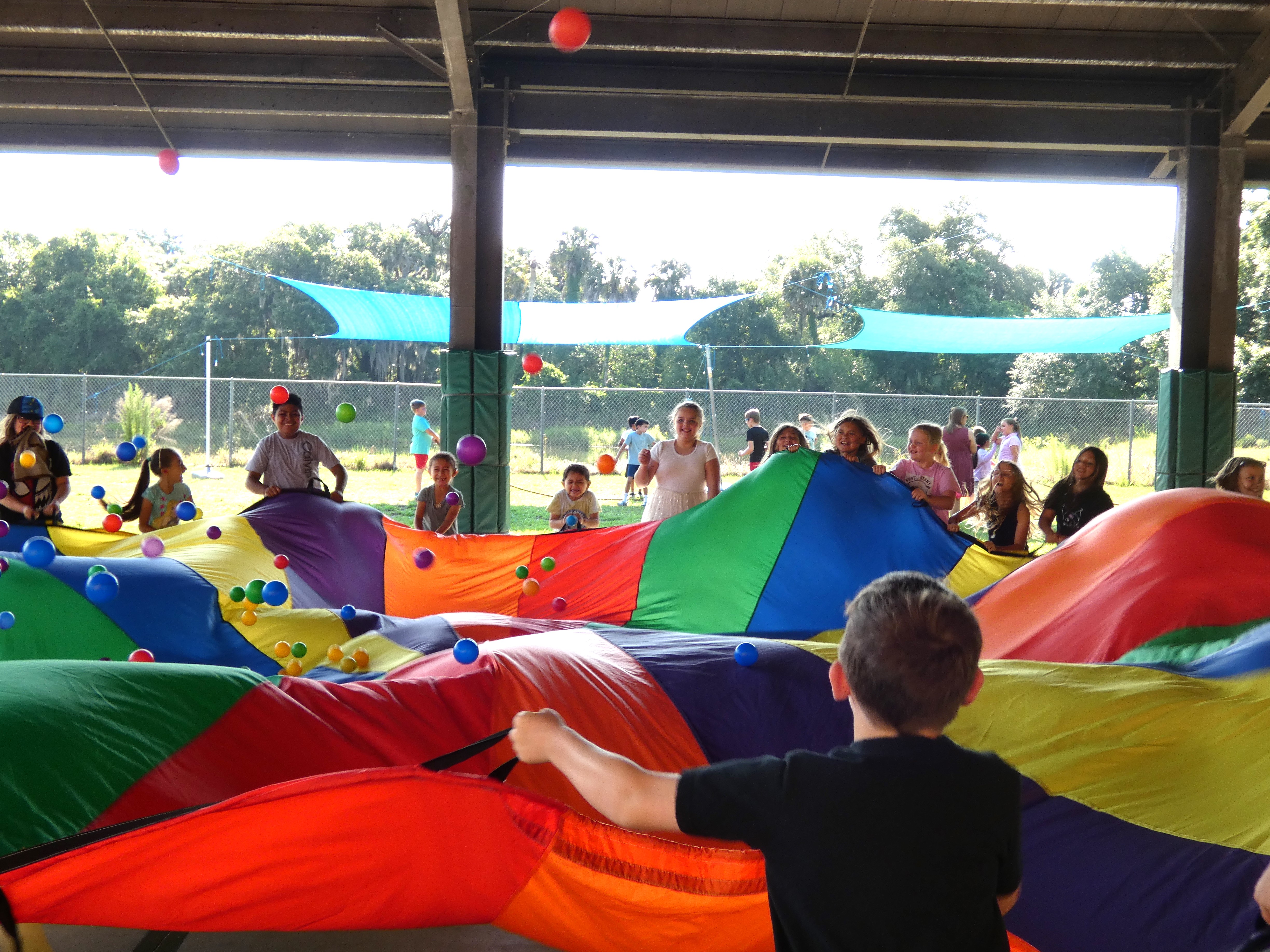 Kids playing parachute