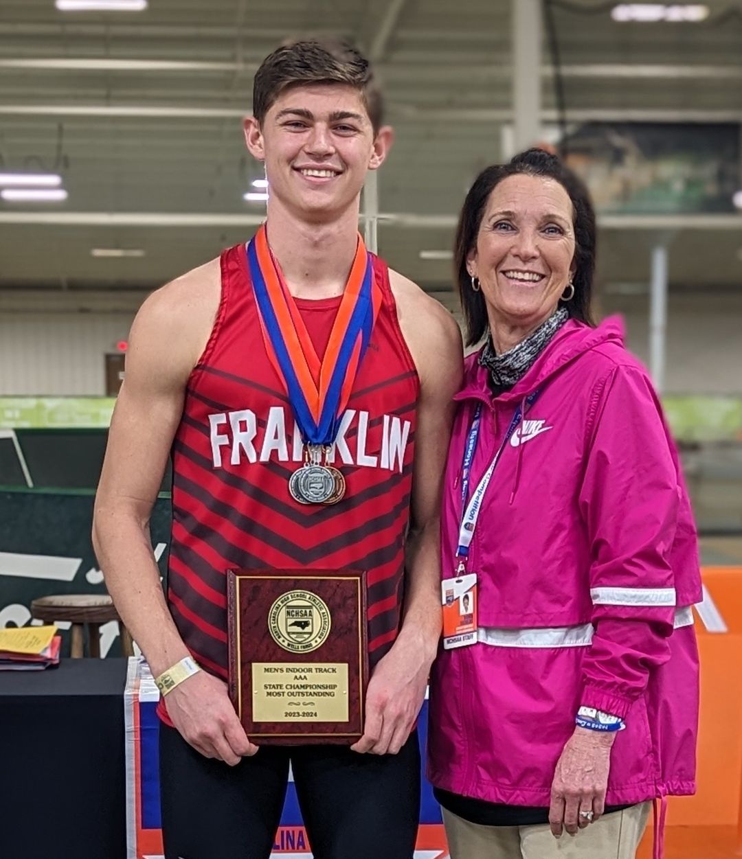 Senior track athlete with medals