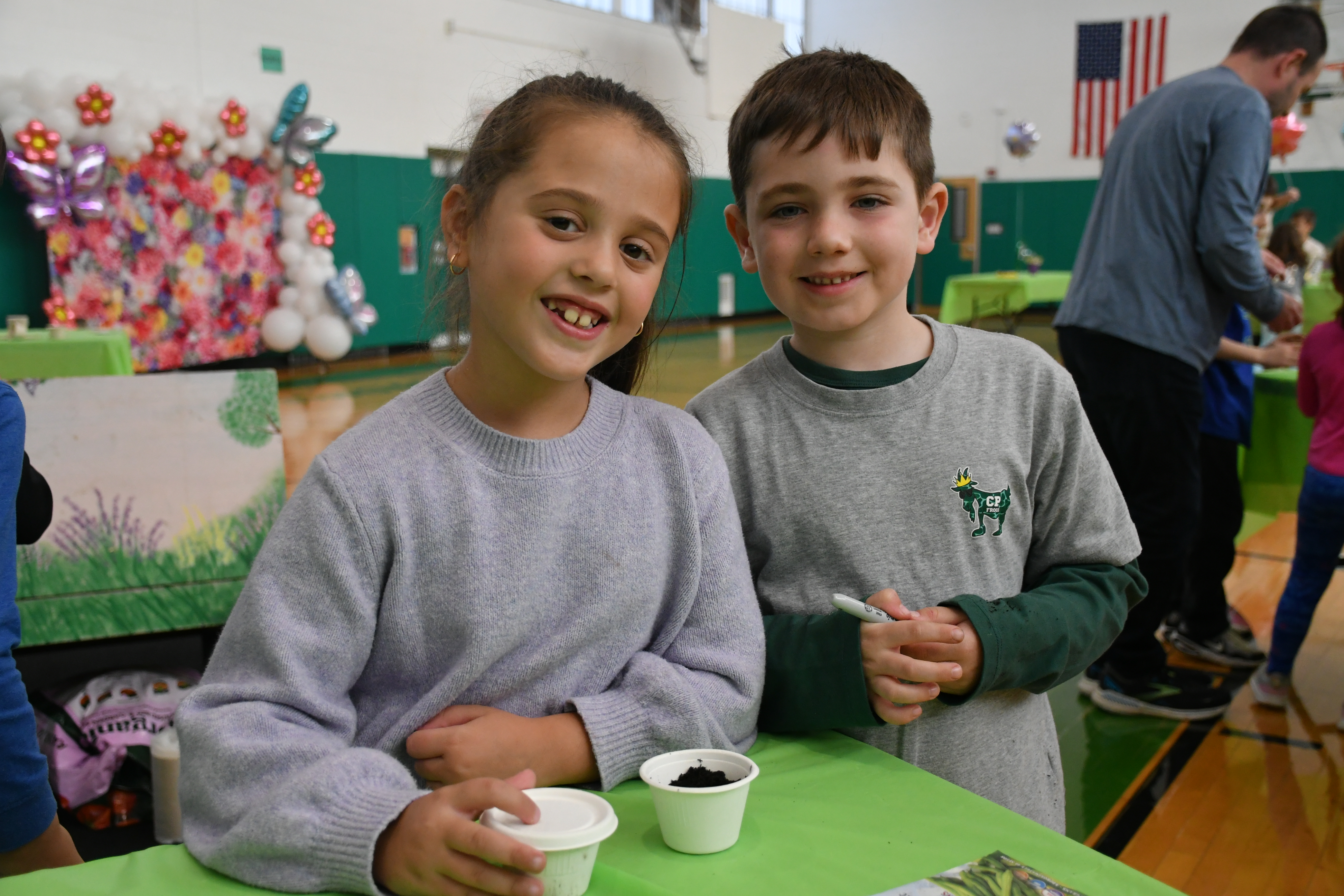 Carle Place students smiling at camera.