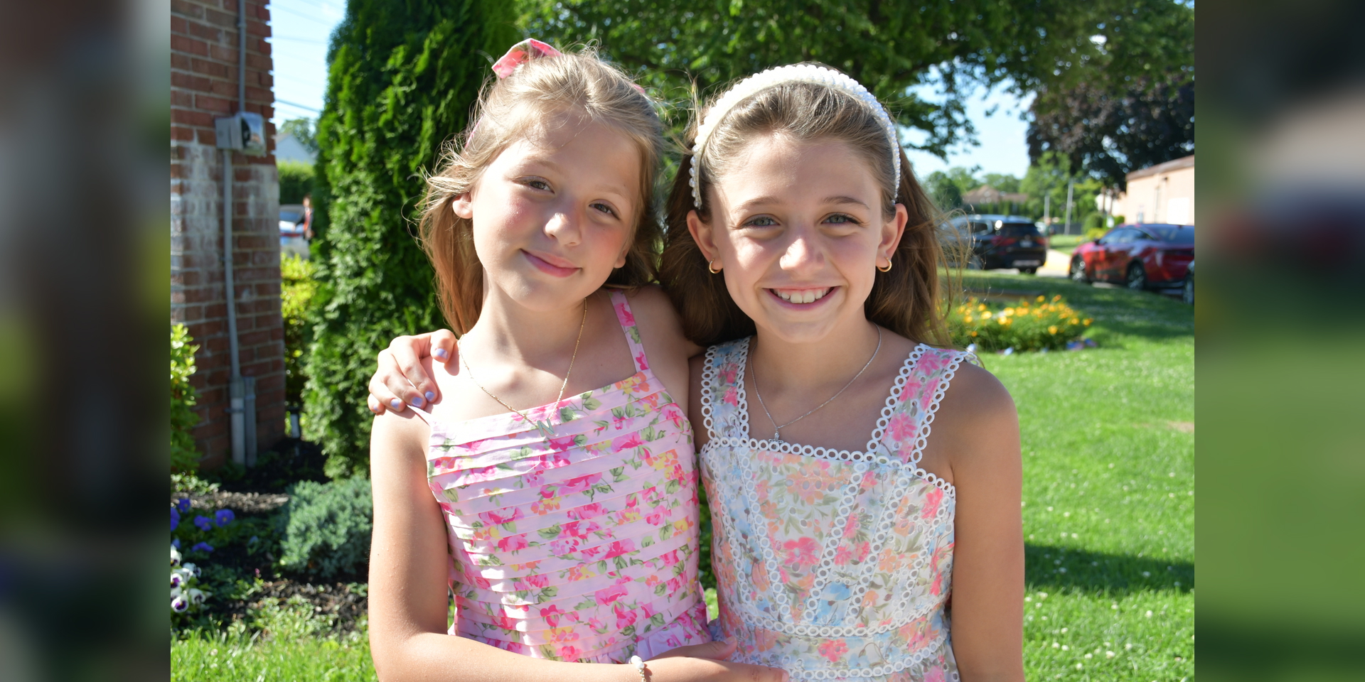 two girls in floral dresses
