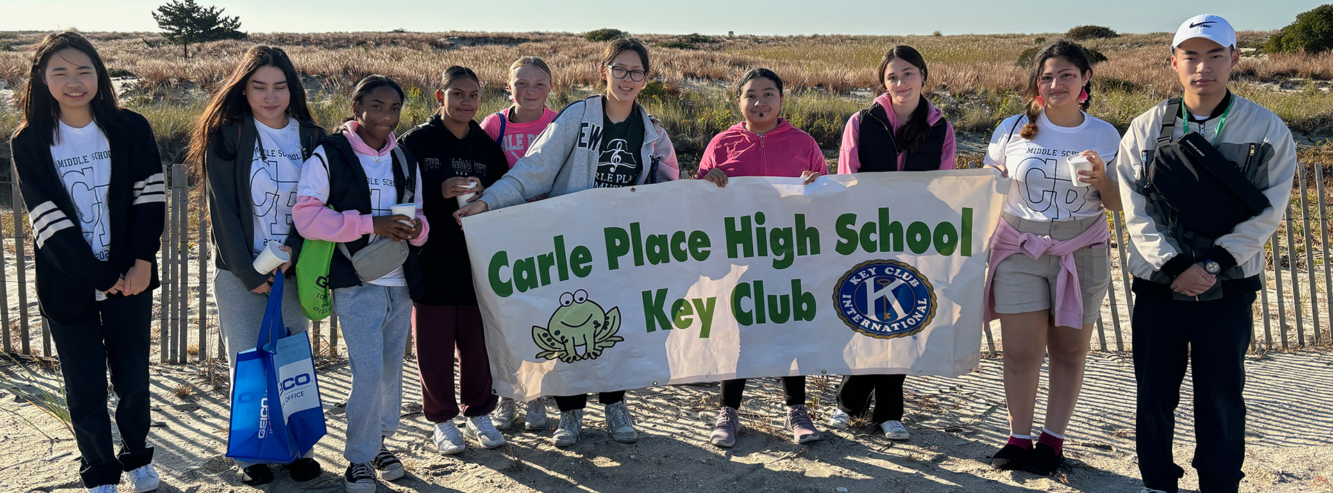 students holding sign