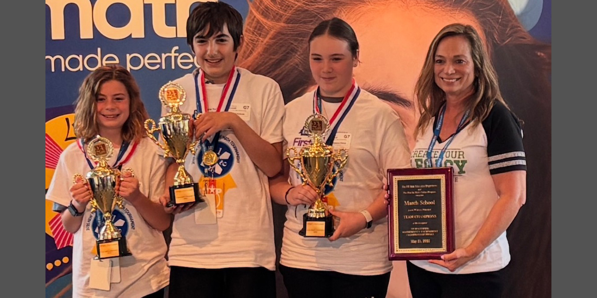 4 students holding their awards