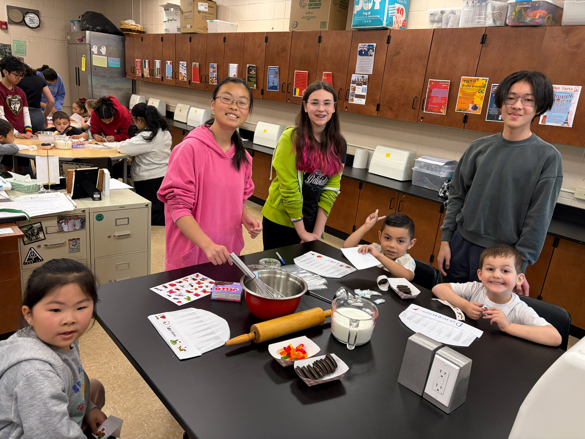 Students sitting at table.