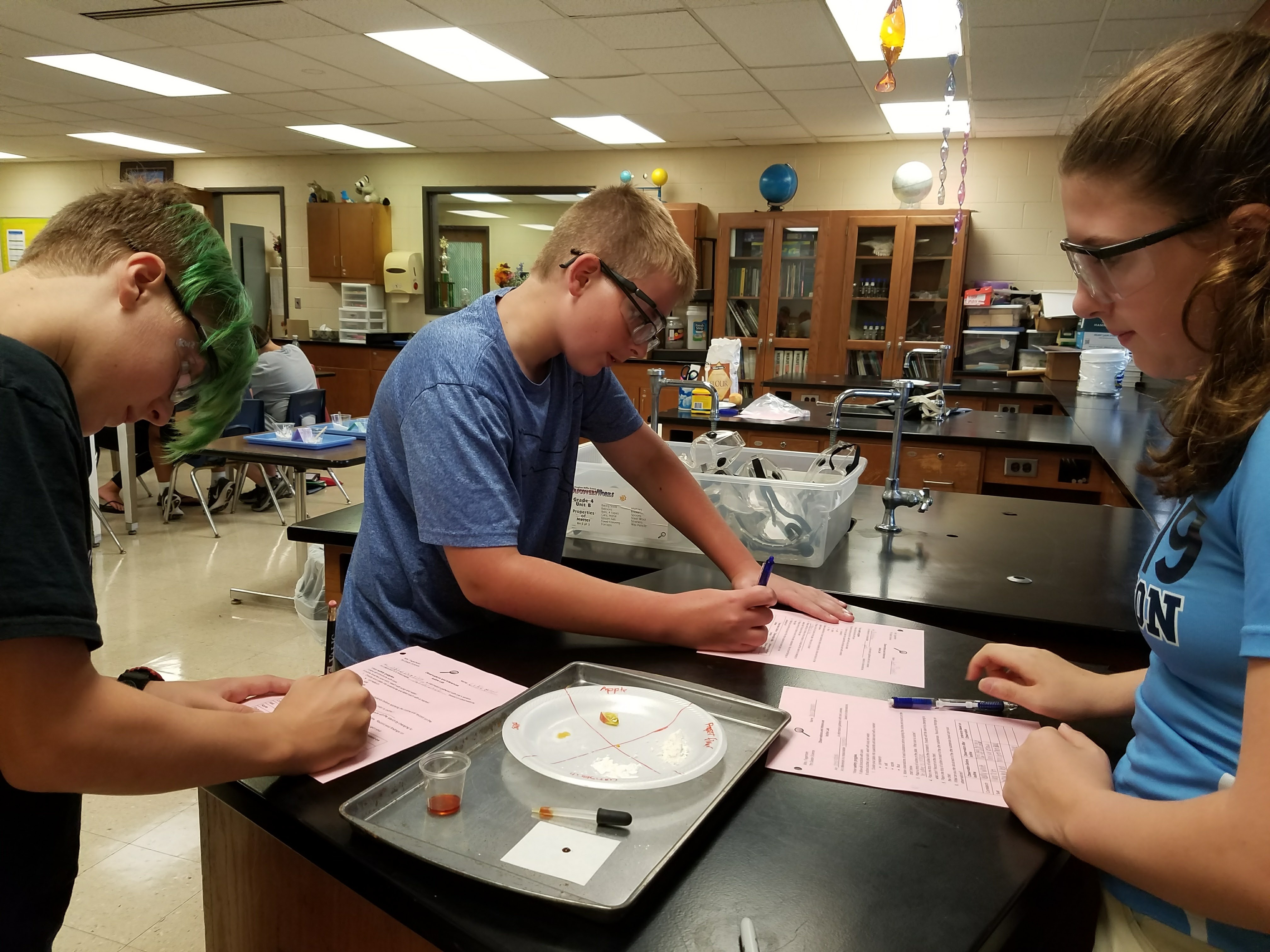 A group of young people working in a science lab