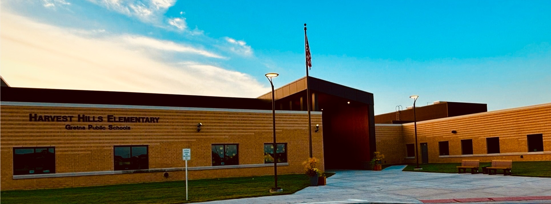 a photo of the Harvest Hills Elementary building with blue sky