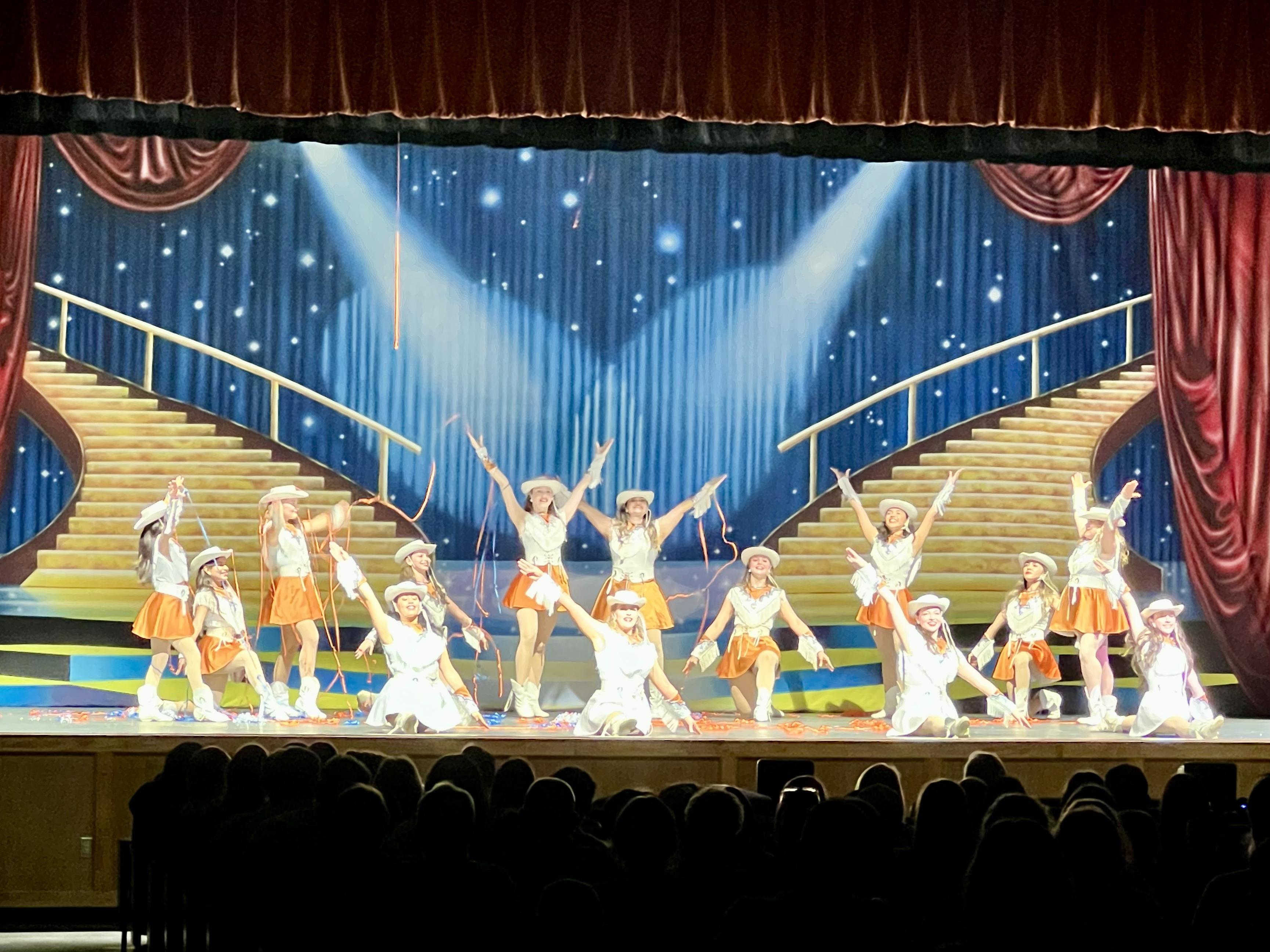 A group of people standing on top of a stage
