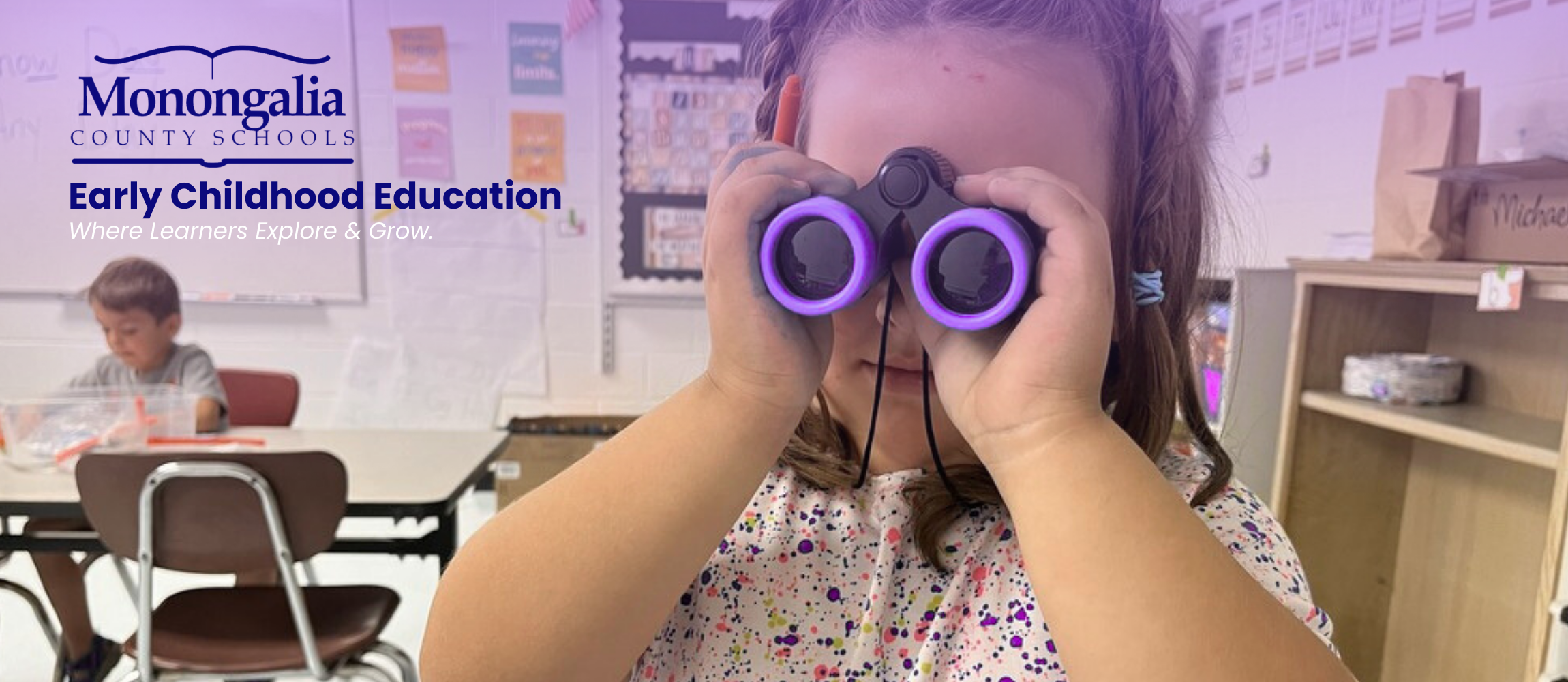 child looking through binoculars 