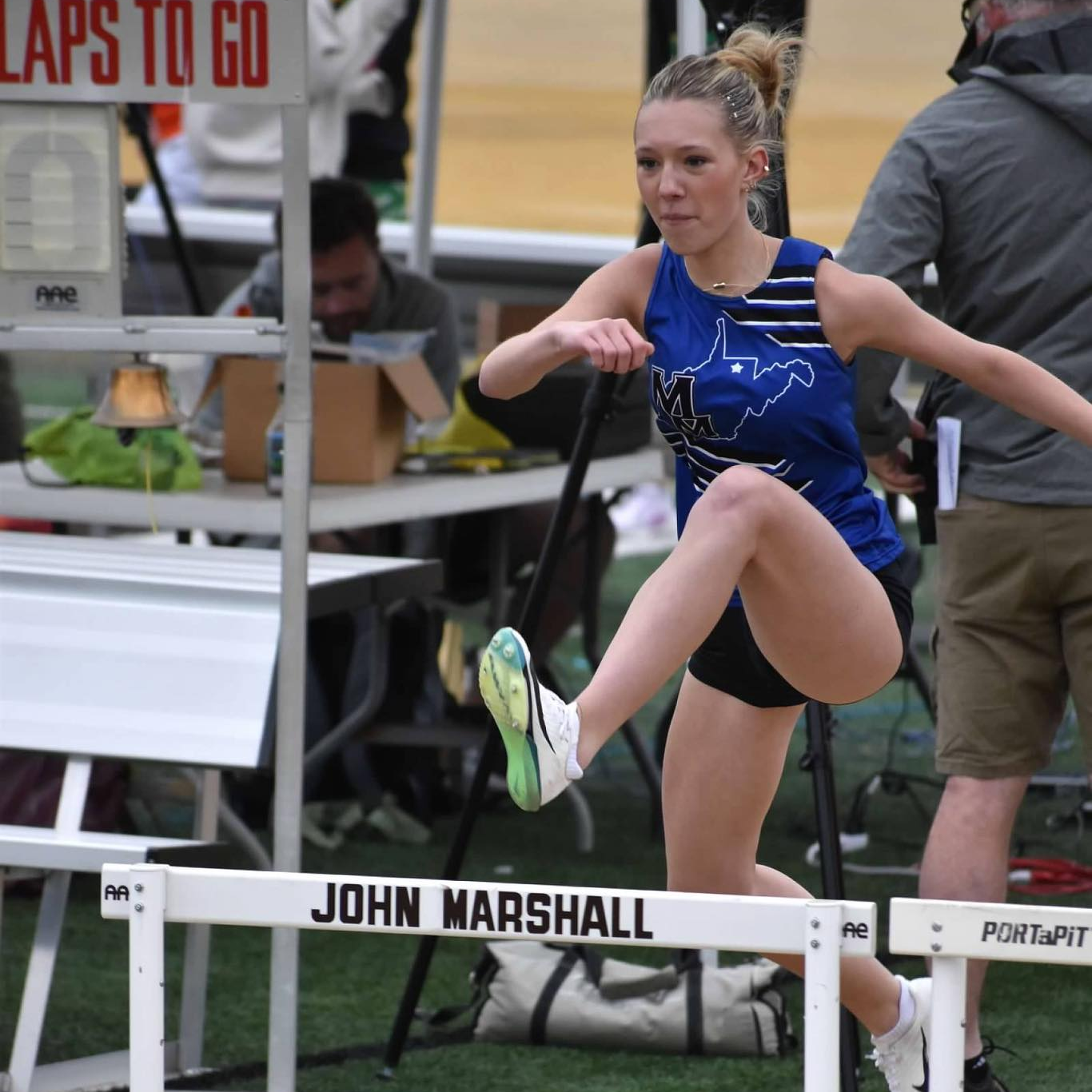girl running hurdles