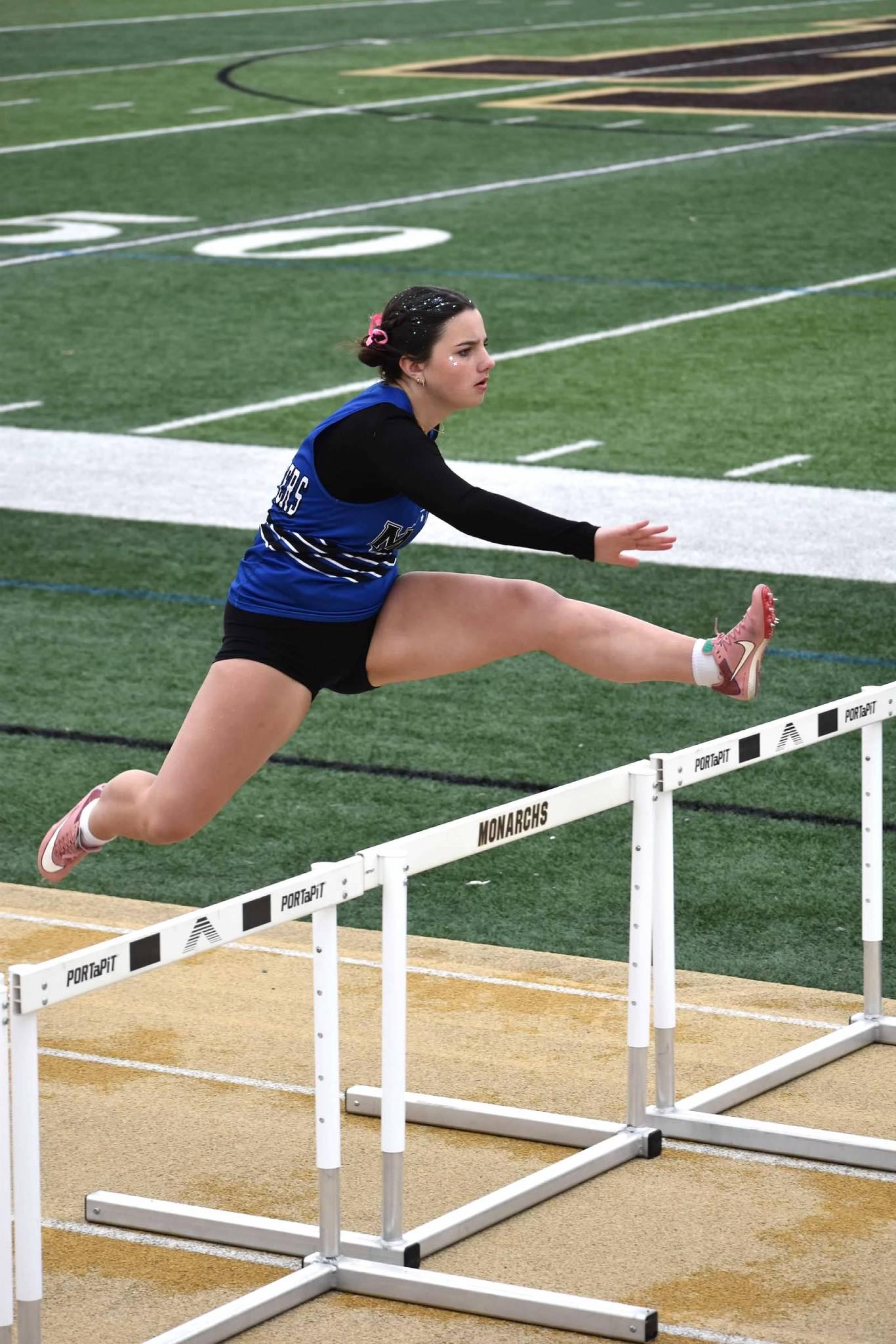 girl running hurdles