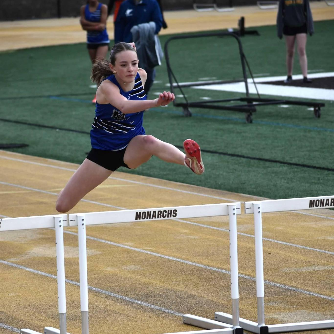 girl running hurdles