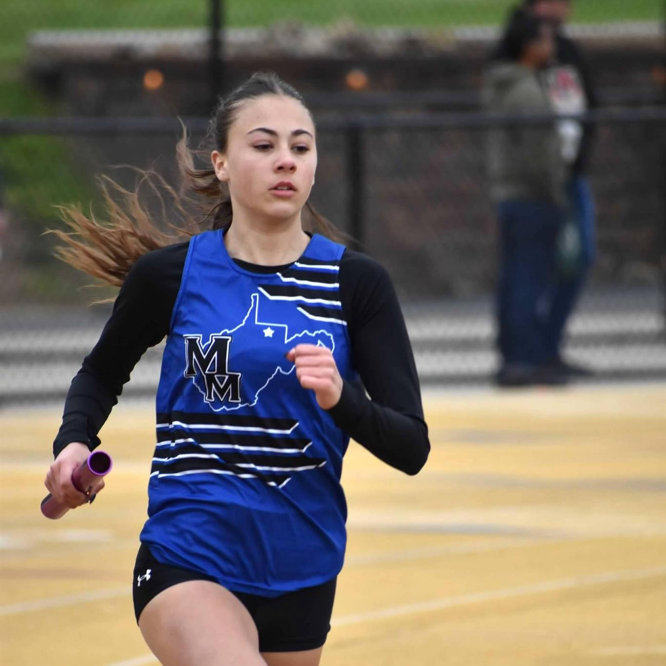 girl running hurdles