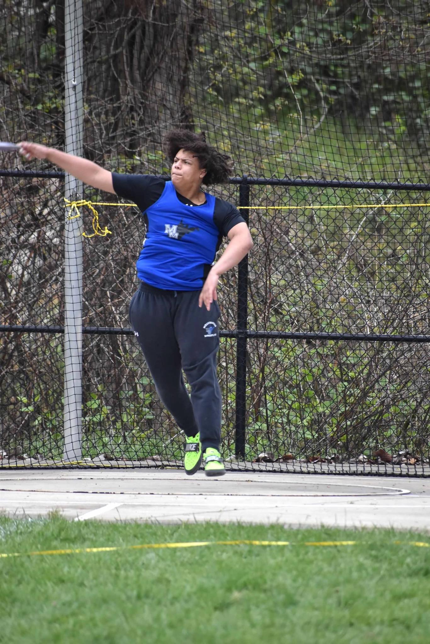 boy throwing shotput