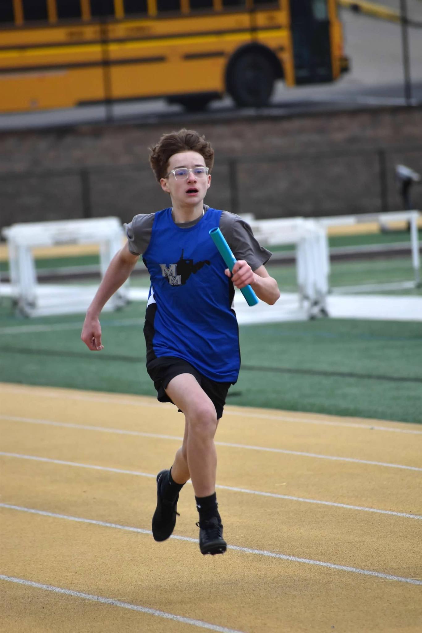 student running a relay