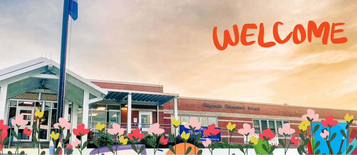 sunset colored sky with welcome with multi colored flowers in front of building