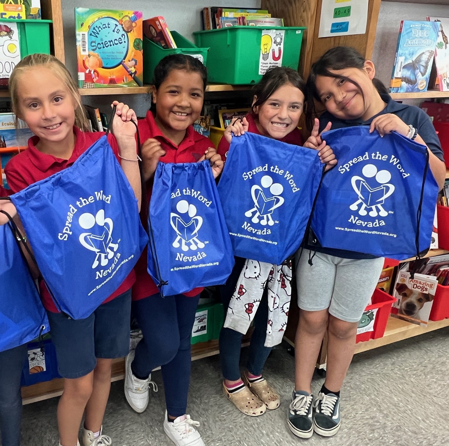 Students with take home STWN book bags