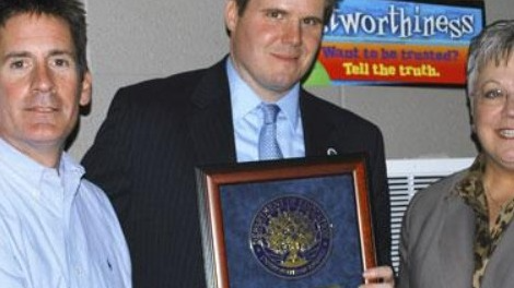 Picture of Former Principal Baldridge receiving the National Blue ribbon Award