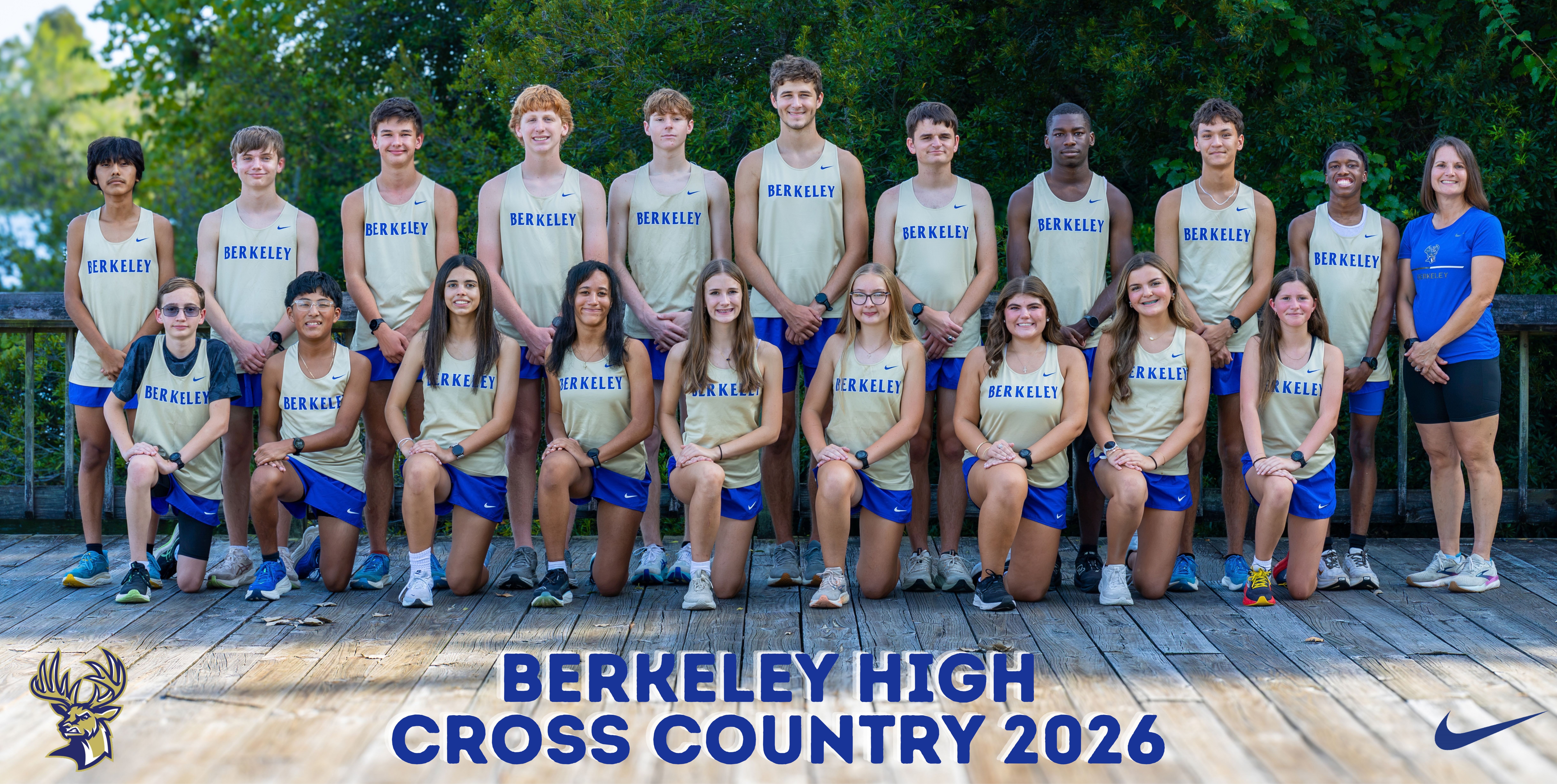 A team of young athletes wearing blue and gold uniforms, posing for a group photo on a wooden deck.