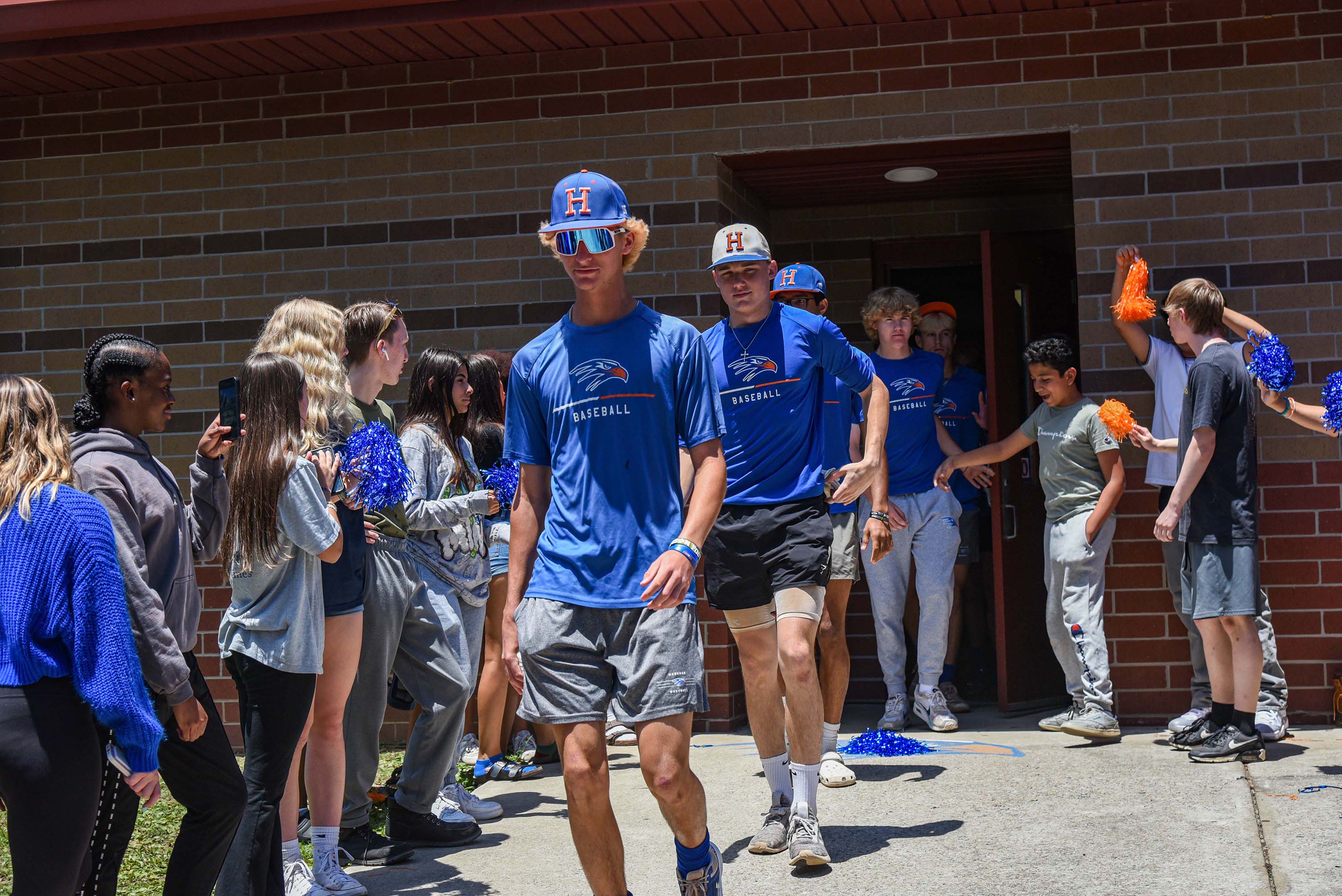 baseball team walking out of tunnel