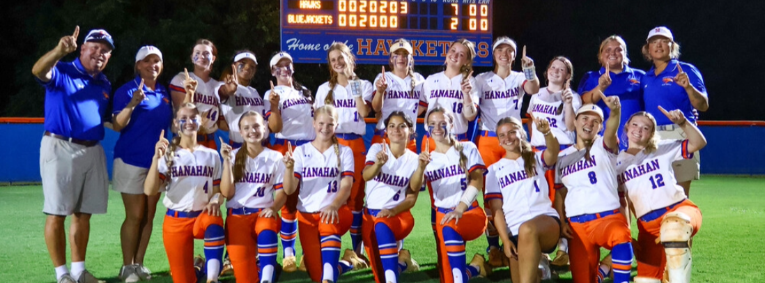 A sports team on a field with a scoreboard showing a score of 11 to 5.